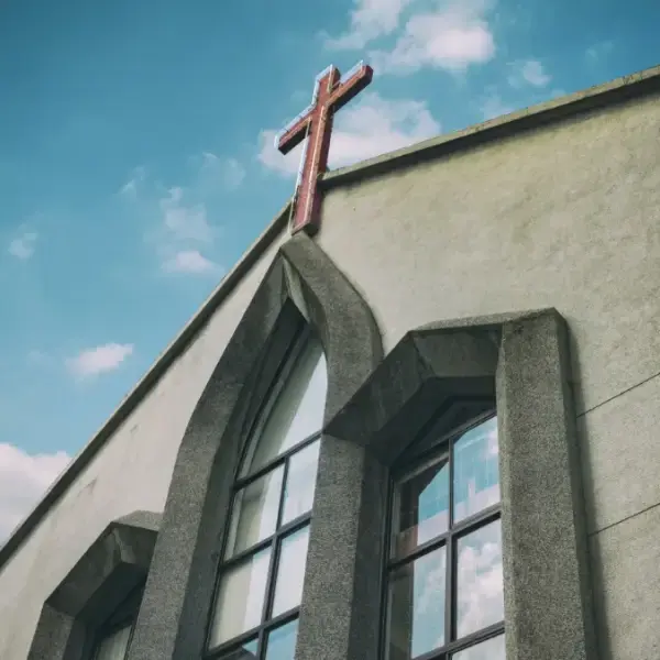 Image of a church against a blue sky.